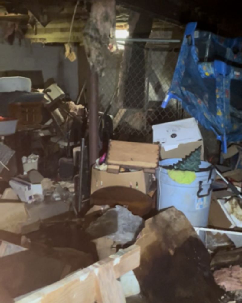 Trash covering the basement of a hoarder house